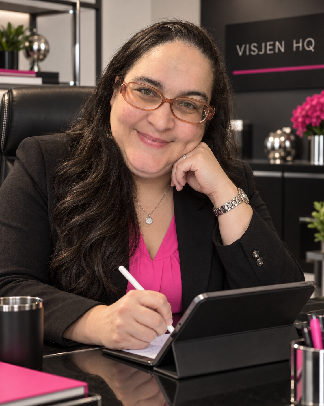 The Jeni B using a stylus and tablet while working at her desk